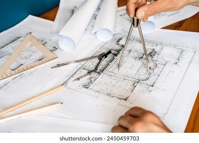 Architectural engineering design plan drawing on the table. Architect's work on table in studio. Construction design and plan