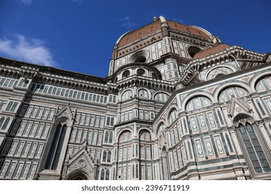 An architectural fragment of the majestic building of the Cathedral of Santa Maria del Fiore, an undisputed masterpiece of sacred architecture on a world scale. Florence, Italy.
