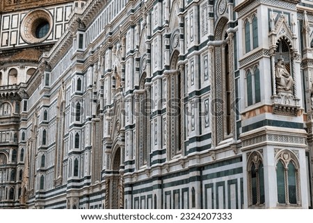 An architectural fragment of the majestic building of the Cathedral of Santa Maria Del Fiore, which is an undisputed masterpiece of sacred architecture on a global scale. Florence, Italy.