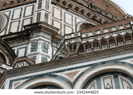 An architectural fragment of the majestic building of the Cathedral of Santa Maria Del Fiore, which is an undisputed masterpiece of sacred architecture on a global scale. Florence, Italy.