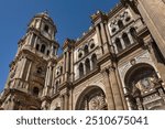 Architectural fragments of Malaga Cathedral facade. Renaissance Cathedral - Roman Catholic Church in the city of Malaga, was constructed between 1528 and 1782. Malaga, Costa del Sol, Andalusia, Spain.