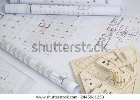 Architectural model with architectural, structural and construction drawings. Rolled up plans