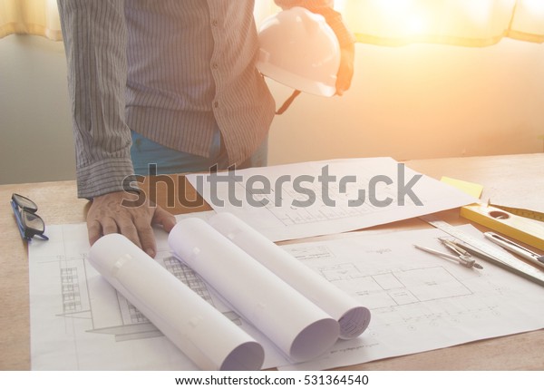 Architectural\
Office desk background construction project ideas concept, With\
drawing equipment with sunlight at\
morning