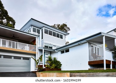 Architectural Photography Of A Grey Coastal Style Home Facade With A Granny Flat Bungalow Off To The Side