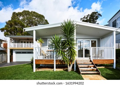 Architectural Photography Of A Grey Coastal Style Home Facade With A Granny Flat Bungalow Off To The Side