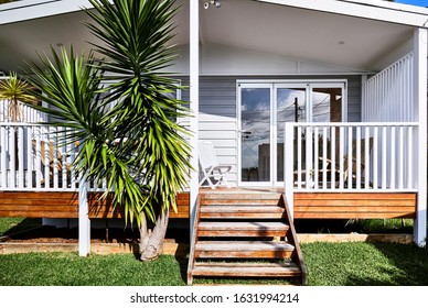 Architectural Photography Of A Grey Coastal Style Granny Flat Facade At The Side Of A Residential Home