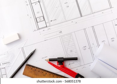 Architectural plans, compasses ,pencils and ruler on wooden table  - Powered by Shutterstock