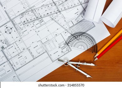 Architectural plans, pencils and ruler on the desk