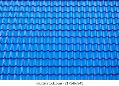 Architectural textured background of blue roof metal tile. Roof of a house with modern metal roof tiles - Shutterstock ID 2171467241