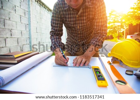 Architectural work site desk background construction project ideas concept, With drawing equipmen