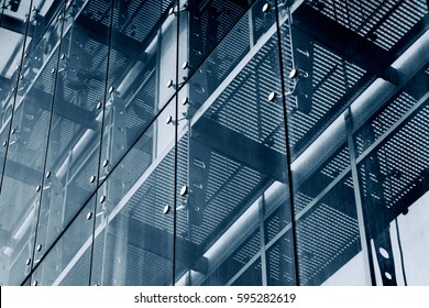 Architecture abstract background. Glass curtain walls. Fasteners elements of spider glass system. Facade detail