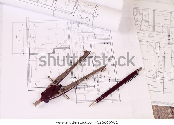 Architecture background: Construction\
plan tools and blueprint drawings , pen and  divider tool \
