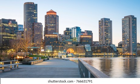 The architecture of Boston in Massachusetts, USA showcasing the mix of contemporary and historic buildings at Boston Harbor and Financial District at night.
