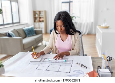 Architecture, Building, Construction And Real Estate Concept - African American Female Architect With Blueprint, Ruler And Living House Model On Table Working At Home Office