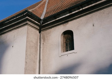 Architecture, building and wall featuring a window, light and shadow enhancing the structure. Historical, exterior and design reflecting artistry and elegance.