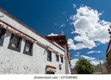 Architecture Of Buildings In Pargor Subdistrict Located In Lhasa, Tibet. Background With Sunny Blue Sky And Clouds.