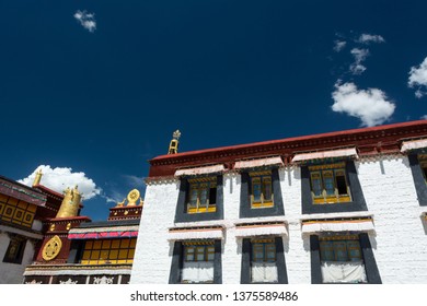 Architecture Of Buildings In Pargor Subdistrict Located In Lhasa, Tibet. Background With Sunny Blue Sky And Clouds.