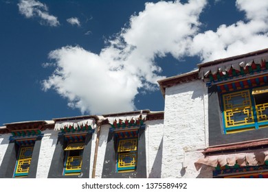 Architecture Of Buildings In Pargor Subdistrict Located In Lhasa, Tibet. Background With Sunny Blue Sky And Clouds.