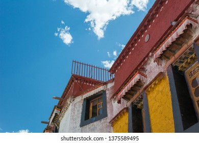 Architecture Of Buildings In Pargor Subdistrict Located In Lhasa, Tibet. Background With Sunny Blue Sky And Clouds.