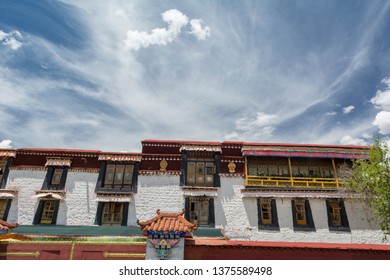 Architecture Of Buildings In Pargor Subdistrict Located In Lhasa, Tibet. Background With Sunny Blue Sky And Clouds.