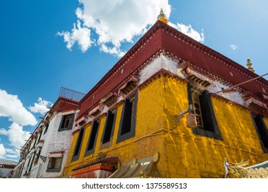 Architecture Of Buildings In Pargor Subdistrict Located In Lhasa, Tibet. Background With Sunny Blue Sky And Clouds.