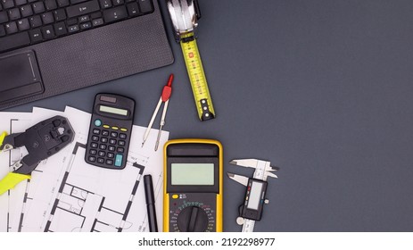 Architecture And Business Table With Plans And Construction Tools. Flat Lay Copy Space