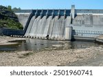 The architecture and construction of this large concrete dam at Beaver Lake in Arkansas can be seen when no water is running.