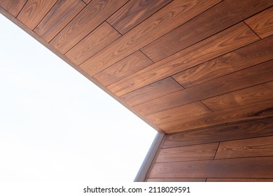 Architecture Detail Of Wooden Cladding And White Sky Light Background