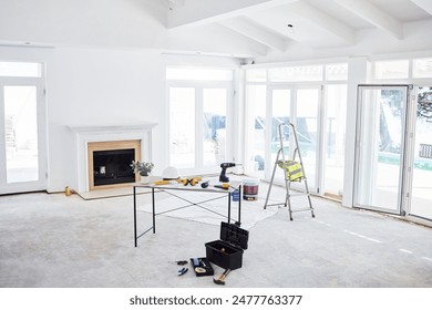 Architecture, development and tools on table in home interior for building, construction or renovation. Design, project management and real estate with equipment in apartment for creative engineering - Powered by Shutterstock