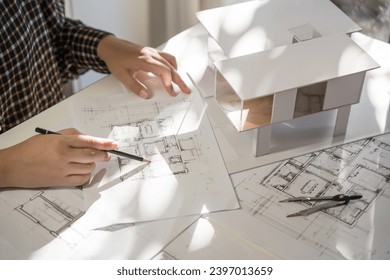 Architecture drawing on architectural Creative project business architecture building construction Industrial engineering Achievement Planning Design on blueprint eco Concept.   - Powered by Shutterstock