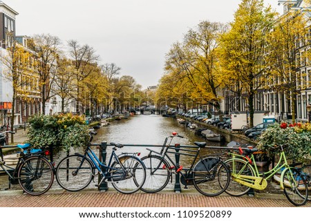 Similar – Foto Bild Architektur niederländischer Häuser Fassade und Hausboote am Amsterdamer Kanal