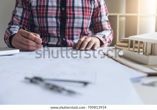 Architecture Engineer Drawing\
and working for architectural project and engineering tools on\
workplace, concept of work on technical drawings and\
construction.