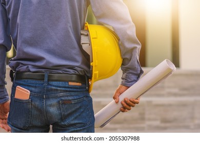 Architecture Engineer Holding Hard Hat On Site Building Construction Background