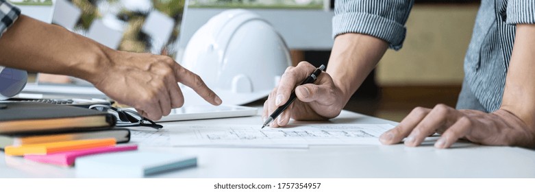 Architecture Engineer Teamwork Meeting, Drawing And Working For Architectural Project And Engineering Tools On Workplace, Concept Of Worksite On Technical Drawing Structure And Construction.