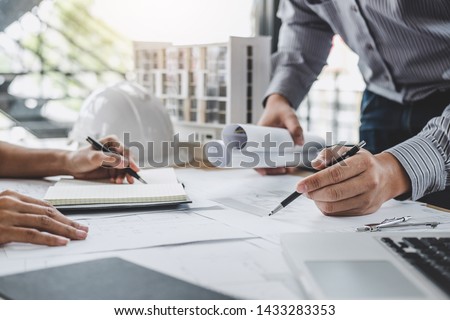 Architecture Engineer Teamwork Meeting, Drawing and working for architectural project and engineering tools on workplace, concept of worksite on technical drawing structure and construction.