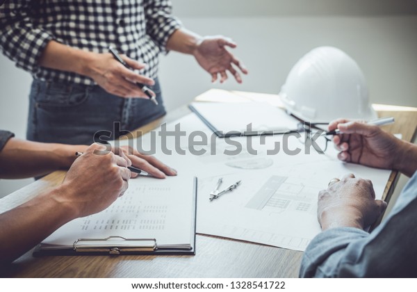 Architecture Engineer Teamwork Meeting,
Drawing and working for architectural project and engineering tools
on workplace, concept of worksite on technical drawing structure
and construction.