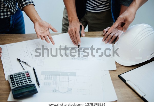 Architecture Engineer Teamwork Meeting,\
Drawing and working for architectural project and engineering tools\
on workplace, concept of worksite on technical drawing structure\
and construction.