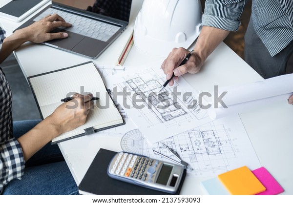 Architecture Engineer Teamwork Meeting,
Drawing and working for architectural project and engineering tools
on workplace, concept of worksite on technical drawing structure
and construction.