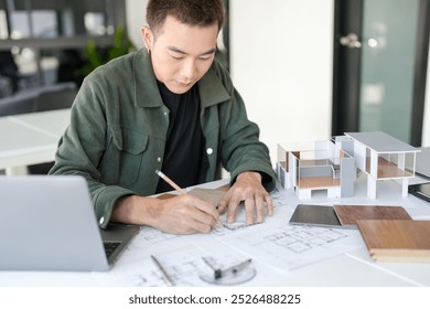 Architecture interior Man Creative project plan designer home and Choose interior materials  drawing interior on blueprint  - Powered by Shutterstock