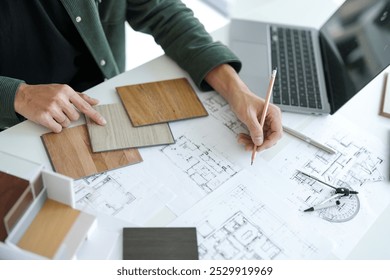 Architecture interior Man Creative project plan designer home and Choose interior materials  drawing interior on blueprint 