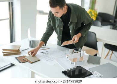 Architecture interior Man Creative project plan designer home and Choose interior materials  drawing interior on blueprint 