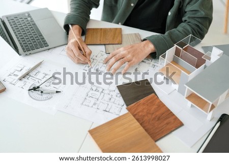 Architecture interior Man Creative project plan designer home and Choose interior materials  drawing interior on blueprint 