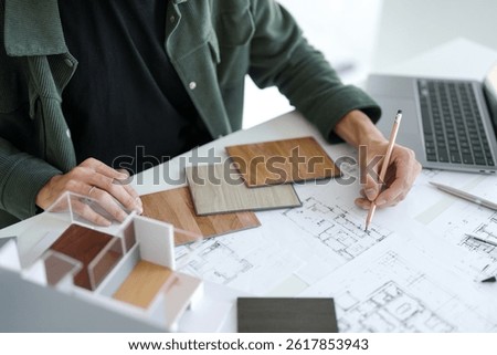 Architecture interior Man Creative project plan designer home and Choose interior materials  drawing interior on blueprint 