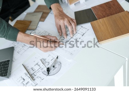 Architecture interior Man Creative project plan designer home and Choose interior materials  drawing interior on blueprint 