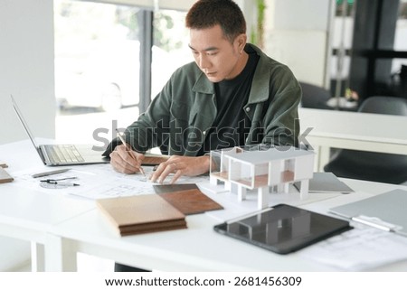 Architecture interior Man Creative project plan designer home and Choose interior materials  drawing interior on blueprint 