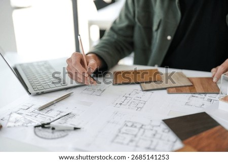 Architecture interior Man Creative project plan designer home and Choose interior materials  drawing interior on blueprint 
