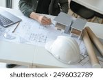 Architecture Man drawing on architectural Creative project business architecture building construction Industrial engineering Achievement Planning Design on laptop.