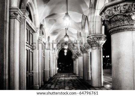 Architecture of old corridor with lamp illuminated in night.