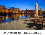 Architecture of the old town in Gdansk over Motlawa river at dusk, Poland