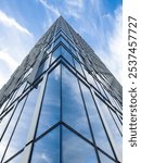 Architecture photography of modern glass and metal skyscraper.  "Ušće Office Tower 2" Height of 22 floors and 103.9 m (341 ft) and a total floor area of 28.000 m2 (301.39 sq ft).